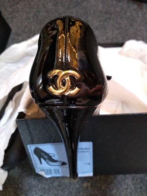Lot 1035 - A pair of Chanel back patent leather T-bar shoes