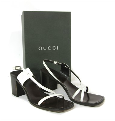 Lot 1043 - A pair of Gucci block heel strap sandals