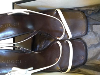 Lot 1043 - A pair of Gucci block heel strap sandals