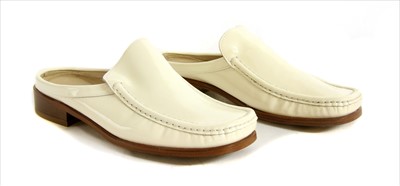 Lot 1053 - A pair of Bally cream patent leather slip on mules