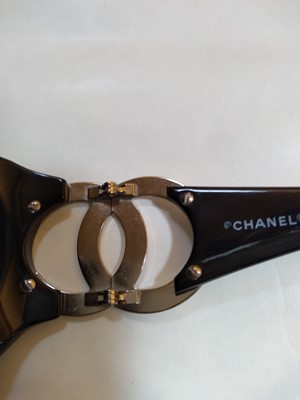 Lot 1128 - A pair of Chanel black framed sunglasses
