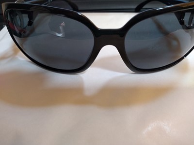 Lot 1128 - A pair of Chanel black framed sunglasses