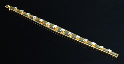Lot 239 - A Continental gold graduated diamond set line bracelet, c.1950