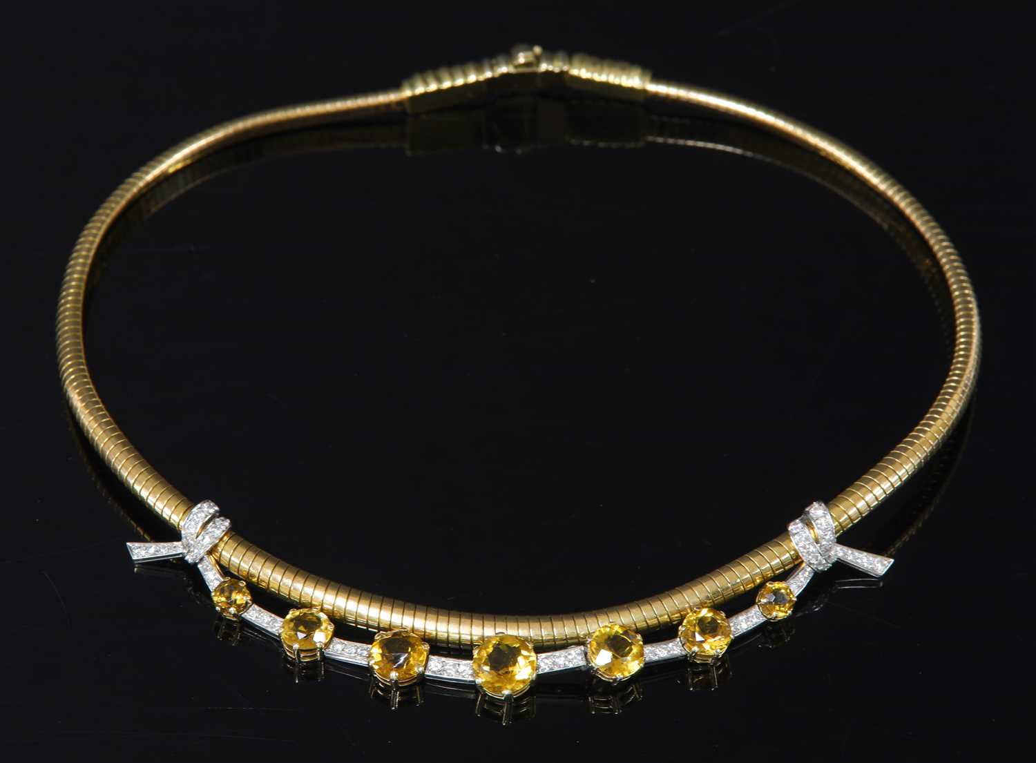 Lot 234 - A two colour gold, platinum, citrine and diamond tubogas necklace, c.1945