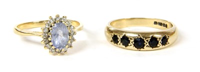 Lot 316 - An 18ct gold sapphire and diamond cluster ring
