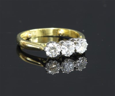 Lot 324 - An 18ct gold three stone diamond ring