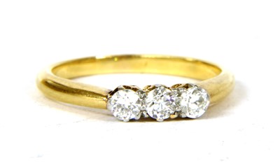 Lot 298 - A gold three stone diamond ring