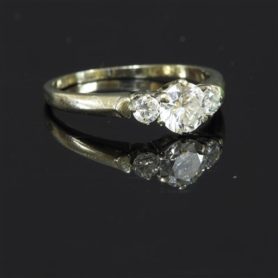 Lot 412 - A white gold three stone diamond ring