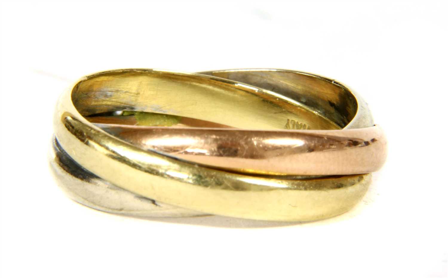 Lot 301 - A three band Russian wedding style diamond ring