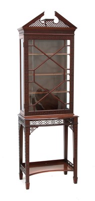 Lot 653 - An early 20th century Chippendale style display cabinet on stand