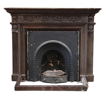 Lot 664 - A large carved breakfront fire surround