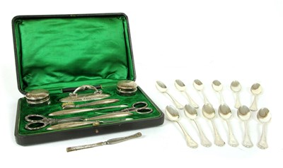 Lot 341 - A set of twelve silver coffee spoons by G M Co Birmingham 1914