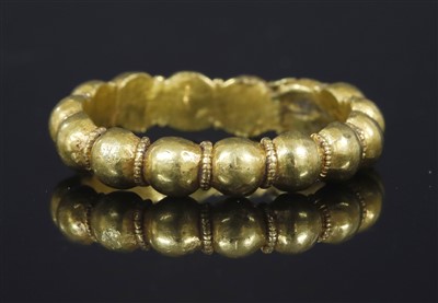 Lot 147 - A medieval-style gold finger ring