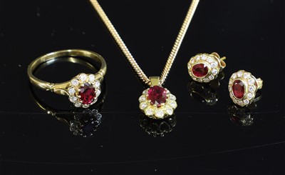 Lot 301 - A gold ruby and diamond cluster pendant necklace, earring and ring matched suite
