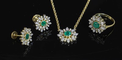 Lot 335 - An 18ct gold emerald and diamond cluster pendant necklace, earring and ring matched suite
