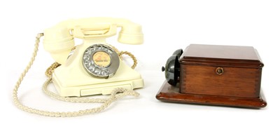 Lot 558 - An ivory Bakelite dial telephone