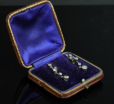 Lot 121 - A pair of gold diamond drop earrings