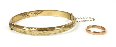 Lot 321 - A 9ct gold hollow D section hinged bangle