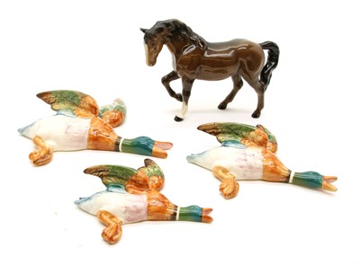 Lot 572 - A graduated set of Beswick flying mallard wall pockets