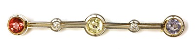 Lot 189 - A gold and platinum sapphire, tourmaline and diamond bar brooch, c.1915