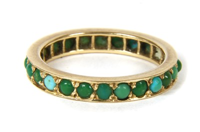 Lot 313 - A gold turquoise full eternity ring