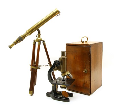 Lot 574 - A brass and black lacquered microscope