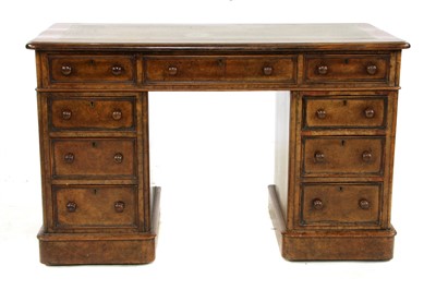 Lot 711 - A Victorian walnut twin pedestal desk