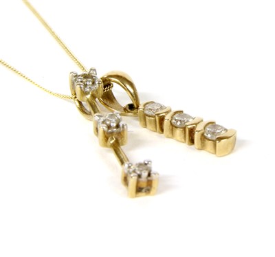 Lot 67A - A gold three stone diamond pendant