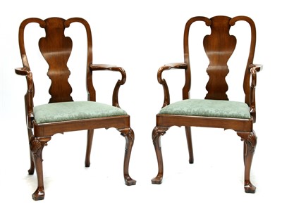 Lot 1642 - A pair of reproduction walnut elbow chairs