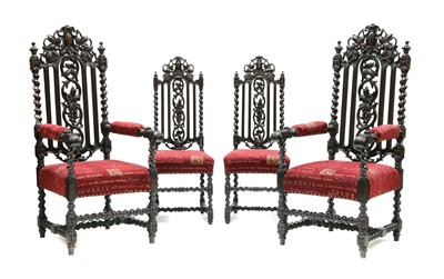 Lot 1646 - A pair of Victorian stained oak throne chairs