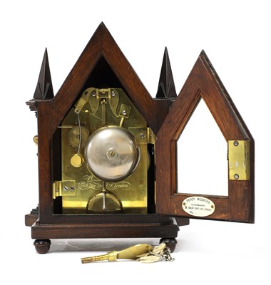 Lot 664 - A Gothic Revival rosewood mantel clock by Perry Webster