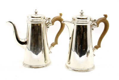 Lot 406 - A matching pair of silver chocolate pots and hot water jug