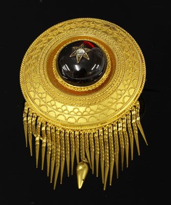 Lot 47 - A Victorian Etruscan Revival circular shield form garnet and diamond brooch, c.1860