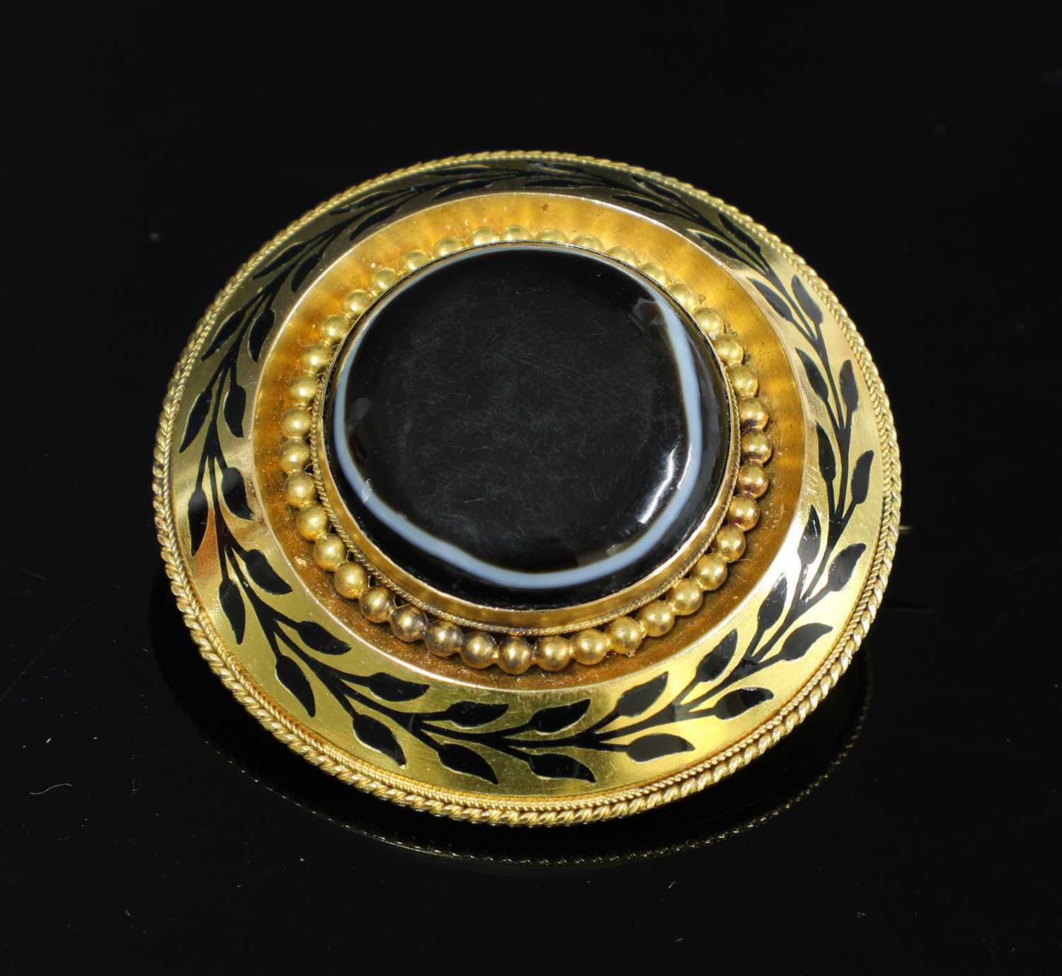 Lot 53 - A Victorian gold, banded agate, circular shield form brooch