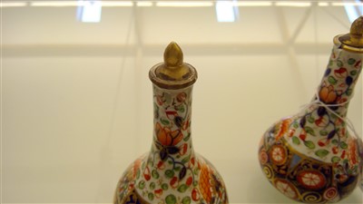 Lot 438 - A pair of Crown Derby squat form vases