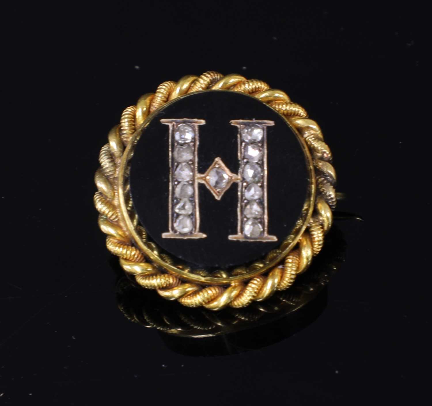 Lot 54 - A Victorian gold cased and diamond set initial brooch