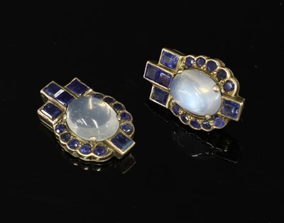 Lot 643 - A pair of moonstone and sapphire cluster earrings