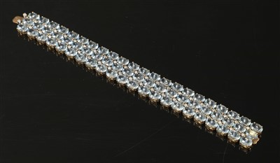 Lot 240 - A gold three row aquamarine and diamond bracelet, c.1950