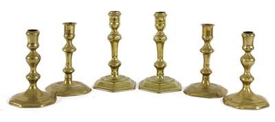Lot 300 - Three pairs of 17th and 18th century brass candlesticks