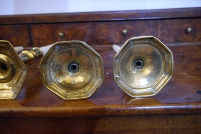 Lot 300 - Three pairs of 17th and 18th century brass candlesticks