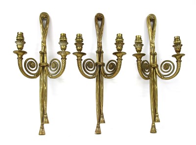 Lot 527 - A group of three early 20th century brass wall lights
