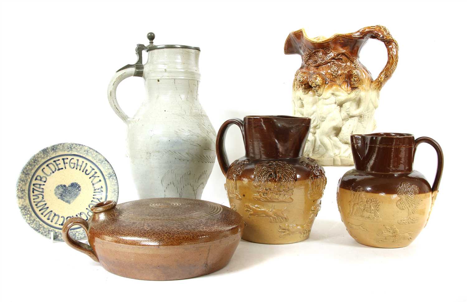 Lot 323 - A collection of glazed stoneware jugs