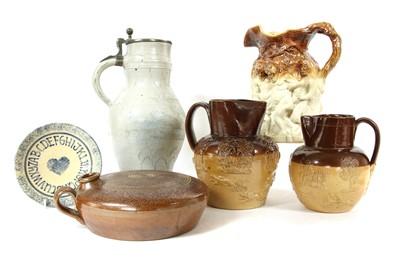 Lot 323 - A collection of glazed stoneware jugs