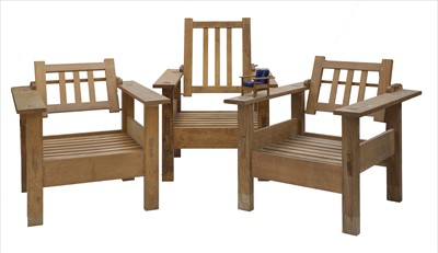 Lot 256 - A set of three oak reclining chairs