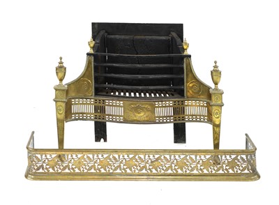 Lot 706 - A neoclassical brass and cast iron fire grate
