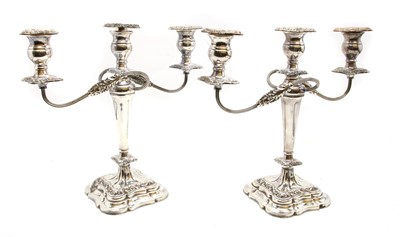 Lot 193 - A pair of silver plated three branch candelabra