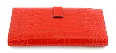 Lot 251 - An  Hermès red alligator skin wallet