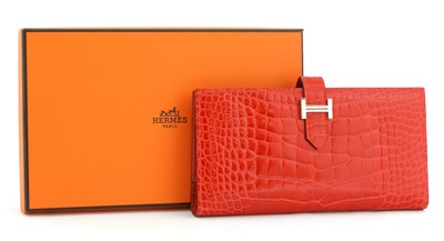 Lot 251 - An  Hermès red alligator skin wallet