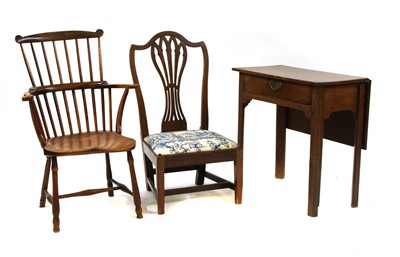 Lot 464 - A George III country made oak tea table