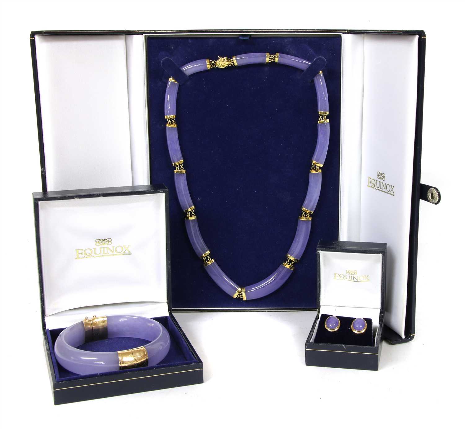 Lot 68 - A gold dyed lavender jade necklace, bangle and earring suite